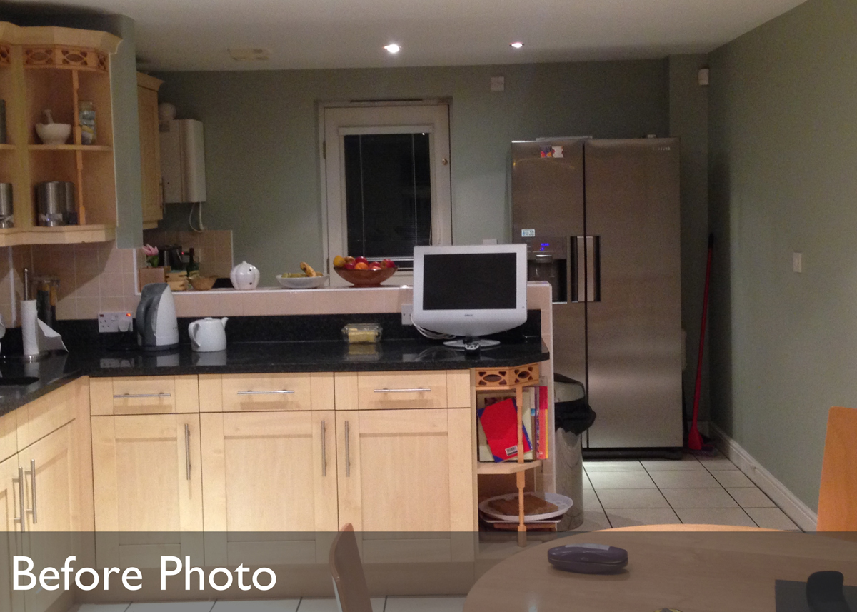 Previous kitchen showing back door which was replaced with wide patio doors